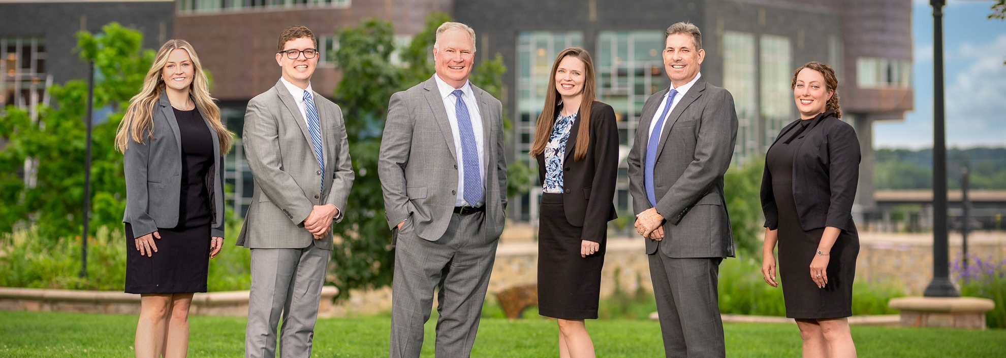 2024 group photo of Stifel's Webb Investment Group outside in front of their building